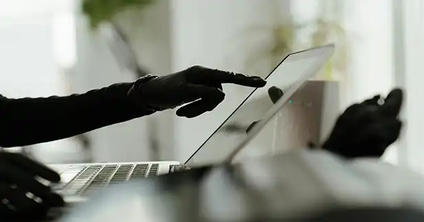 Person safely buying gift cards online while avoiding scam websites and fraudulent offers