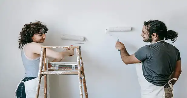 DIY enthusiast using home improvement gift cards to purchase tools and materials for a home renovation project