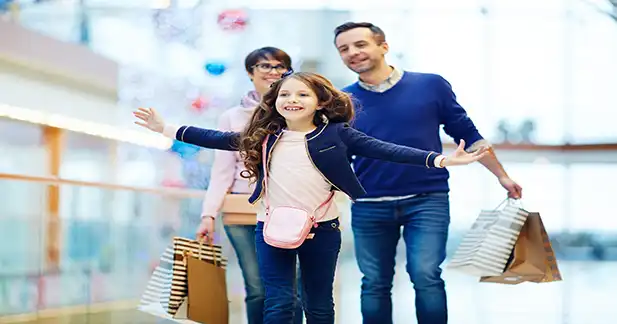 Person using gift cards for everyday shopping, groceries, dining, and online purchases